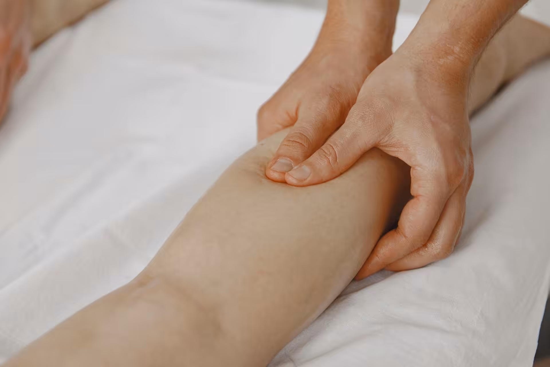 Therapeutic massage on leg muscle