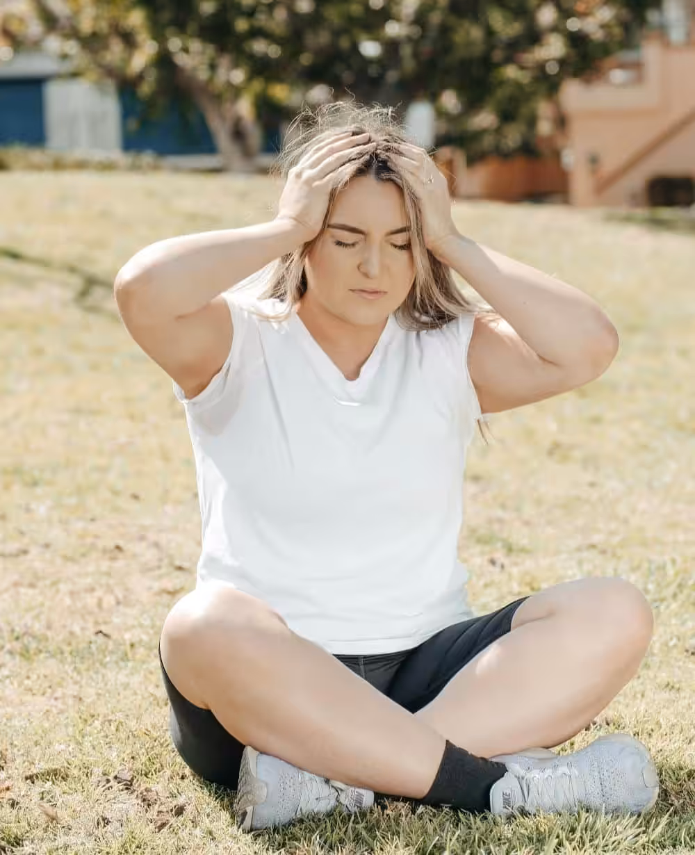 Woman showing signs of fatigue and stress