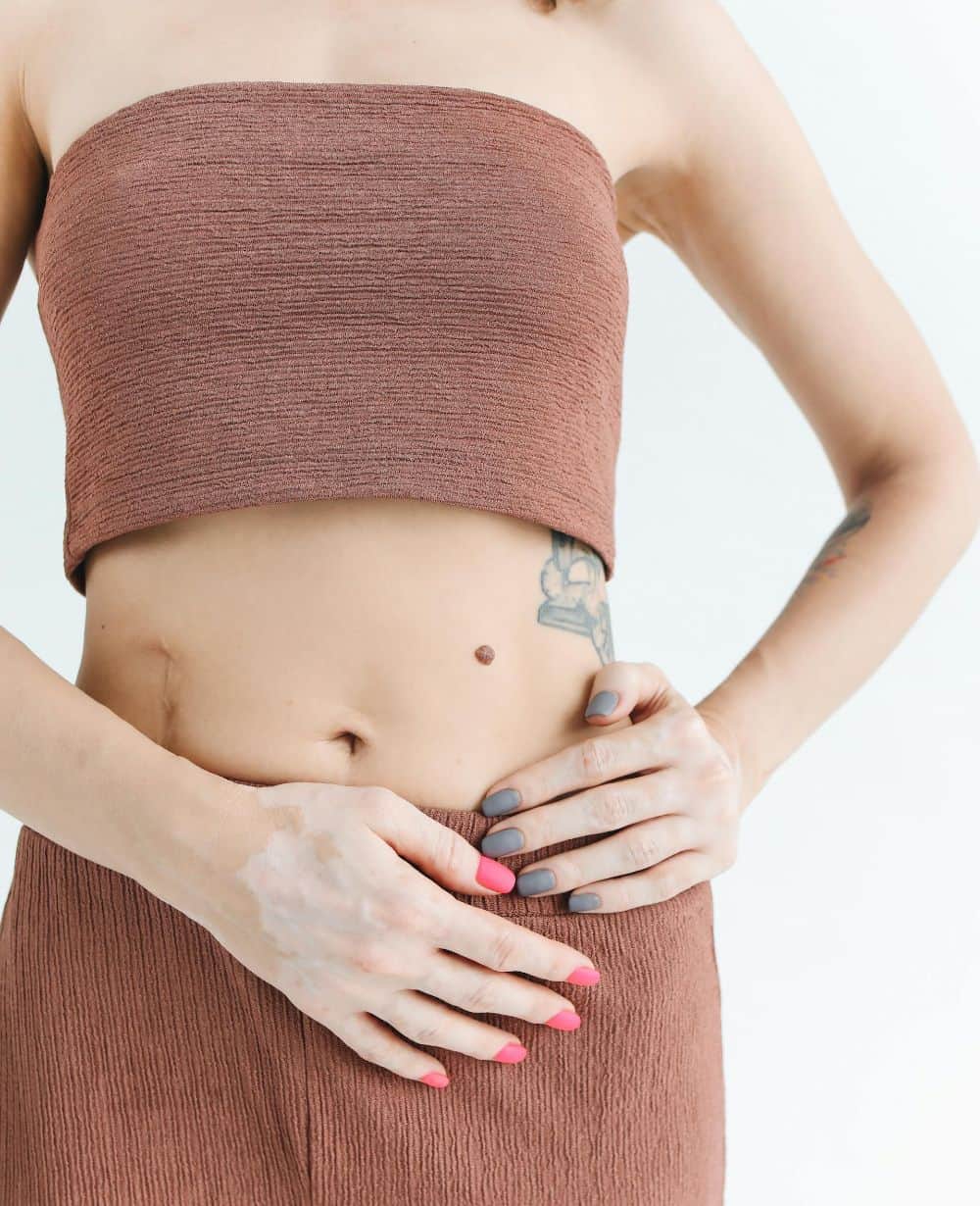 woman grabbing waist image